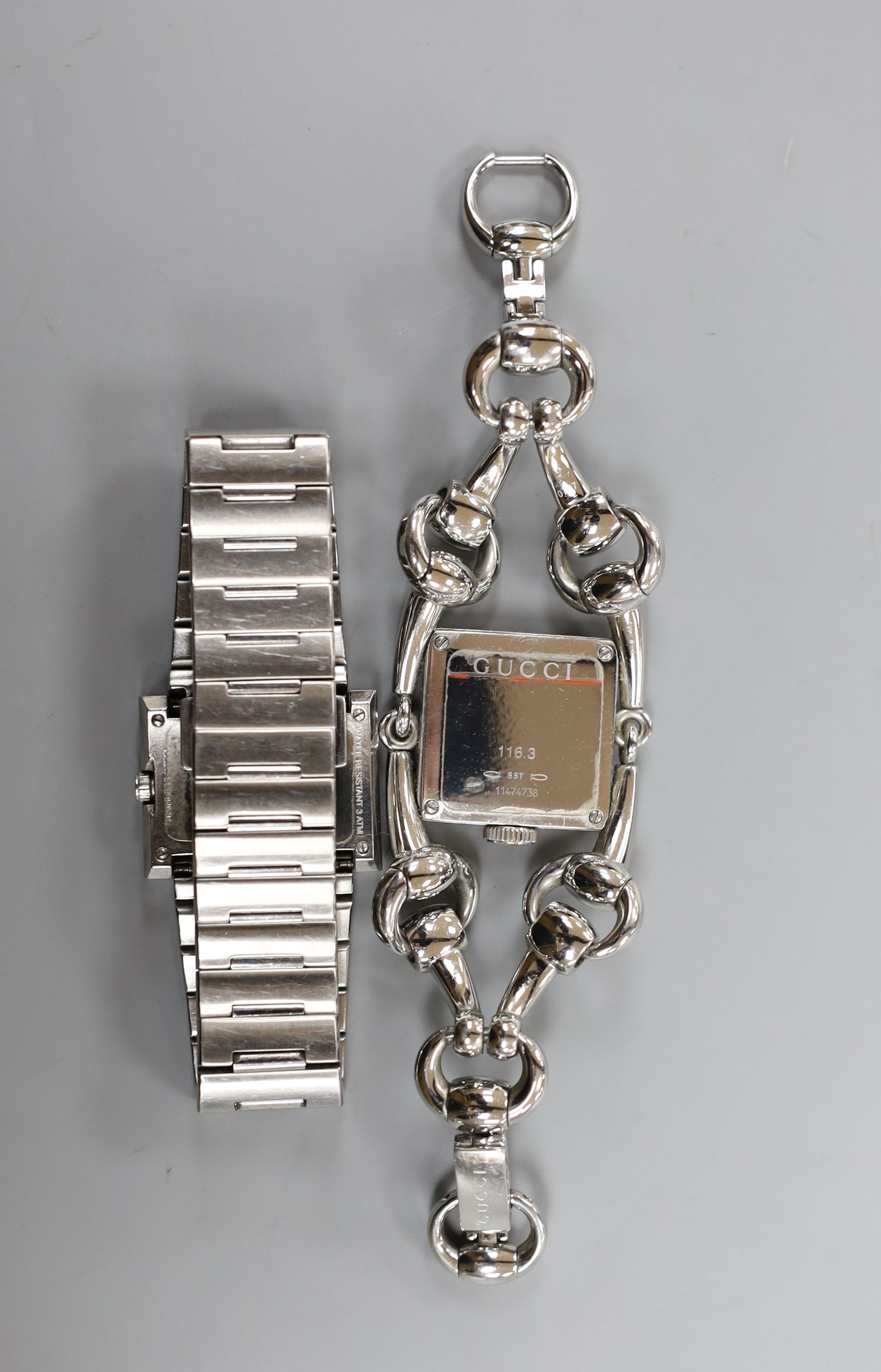 Two lady's modern steel Gucci quartz wrist watches, including one with mother of pearl dial with box.